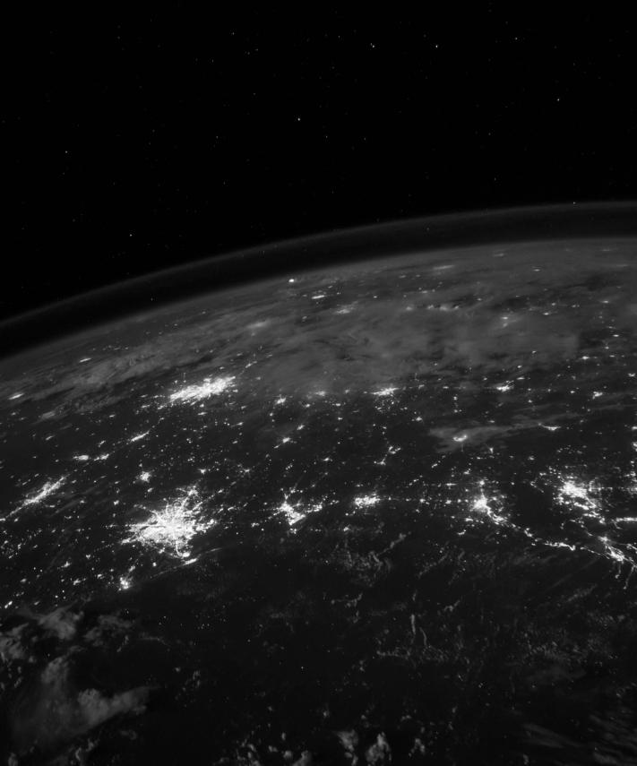 Earth at night from space, representing blockchain’s global traceability and protection